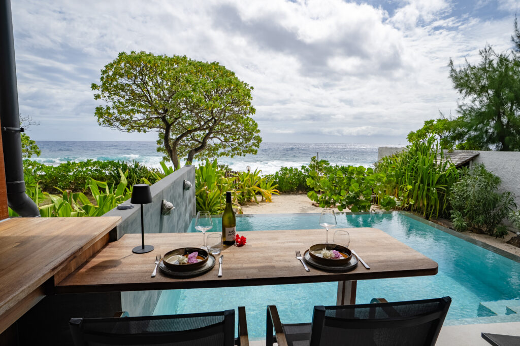 Romantic poolside dining for two overlooking the private infinity pool and Pacific Ocean at Moorea Ocean Love, French Polynesia